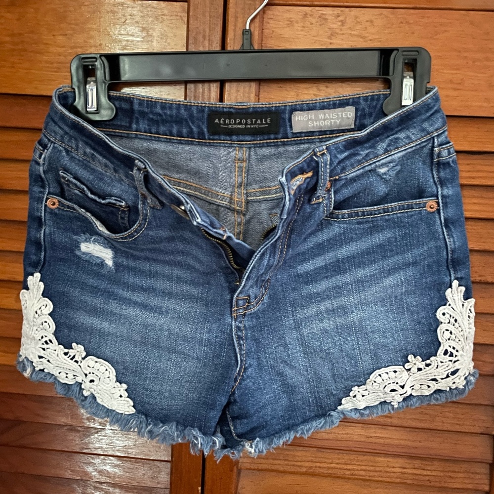 Aeropostale high-waisted blue denim shorts with white floral designs